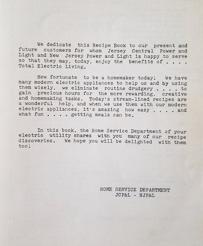 May include: A vintage printed page from a recipe book featuring black typewriter-style text on a white background. The text is a dedication from the Home Service Department of Jersey Central Power and Light and New Jersey Power and Light.