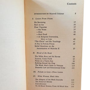 May include: Open book displaying a table of contents. The text includes "Letters From Prison," "Blood of the Beast," and "White Woman, Black Man." The page is off-white with black text. The book is open to the contents page.