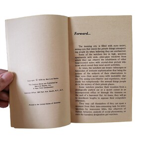 May include: An open book with text on aged paper. The left page shows copyright information from 1970 by Bee-Line Books, Inc. The right page begins with the word "Forward..." and continues with descriptive text about observing others.