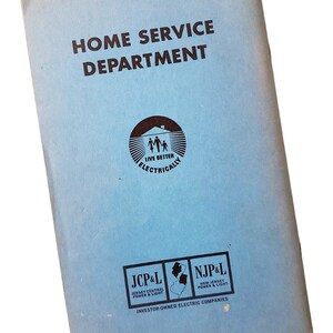 May include: A light blue rectangular booklet titled HOME SERVICE DEPARTMENT in dark brown text. It features a circular logo with a family silhouette and the text LIVE BETTER ELECTRICALLY, plus JCP&L and NJP&L logos with a map of New Jersey.