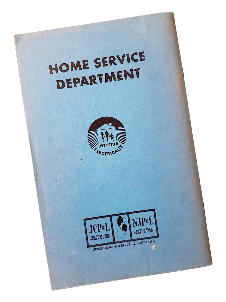 May include: A light blue rectangular booklet titled HOME SERVICE DEPARTMENT in dark brown text. It features a circular logo with a family silhouette and the text LIVE BETTER ELECTRICALLY, plus JCP&L and NJP&L logos with a map of New Jersey.