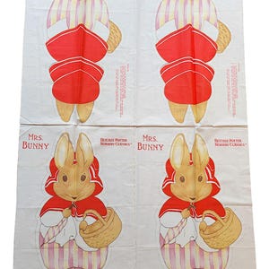 May include: A fabric panel with four illustrations of Mrs. Bunny from Beatrix Potter's Nursery Classics. Each image shows Mrs. Bunny in a red cape and bonnet, carrying a basket. The background is white with a subtle dotted pattern.