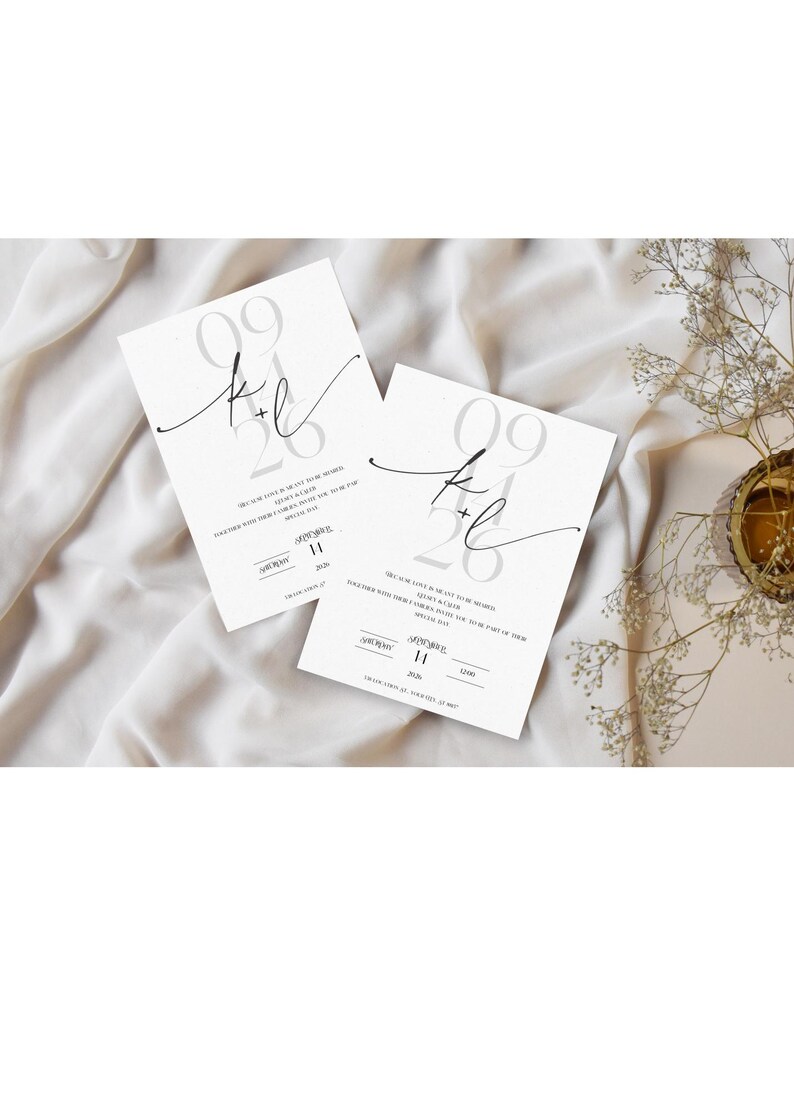 May include: Two white wedding invitations with a gray and black design. The invitations feature the date "09.26" and the text "K+L" in a script font. The invitations also include the text "We're so in love!" and "We're getting married!"