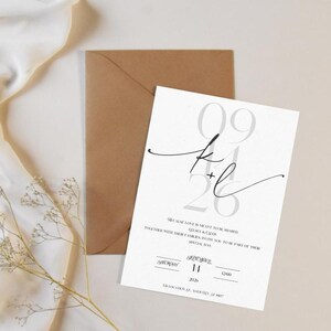 May include: A white wedding invitation with black calligraphy and gray numbers. The invitation reads "We are so love to invite you to celebrate our wedding. Please join us for a perfect party for some part of their special day." The date is September 11, 2026.