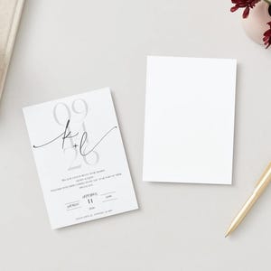 May include: A white wedding invitation with a gray and black design. The invitation features the date "09.26" and the initials "K+L" in a script font. The text on the invitation reads "We are so excited to invite you to celebrate with us as we say "I do"."