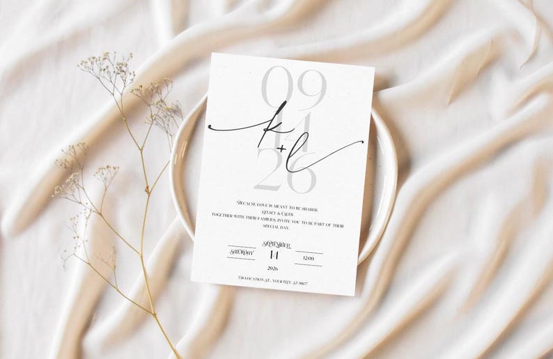 May include: A white wedding invitation with black calligraphy and the date 09.26. The invitation reads "Save the Date" and includes the names of the couple, the date, and the time of the wedding.