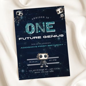 May include: A navy blue invitation card with a robot theme. The card reads "Addison is One Future Genius" with event details. The design includes robot illustrations and circuit board-style text. The invitation is set against a white, silky background.
