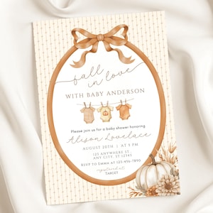 May include: Baby shower invitation with a fall theme. The invitation features a brown oval frame with a bow at the top and the words "fall in love with Baby Anderson." The invitation includes the name Alison Lovelace, date, time, and location.