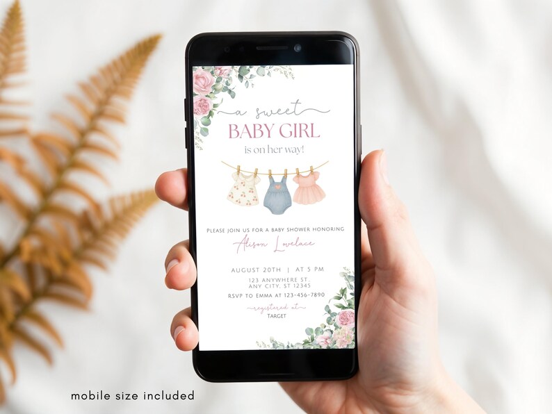 May include: A mobile phone screen shows a baby shower invitation. The design includes the text "a sweet BABY GIRL is on her way!" and illustrations of baby clothes. Floral decorations and event details are also visible.