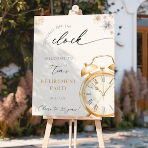 May include: A retirement party sign on an easel. The sign is cream-colored with gold accents and features the text "Officially Off The Clock" and "Welcome to Tim's Retirement Party". A gold clock illustration is also present.