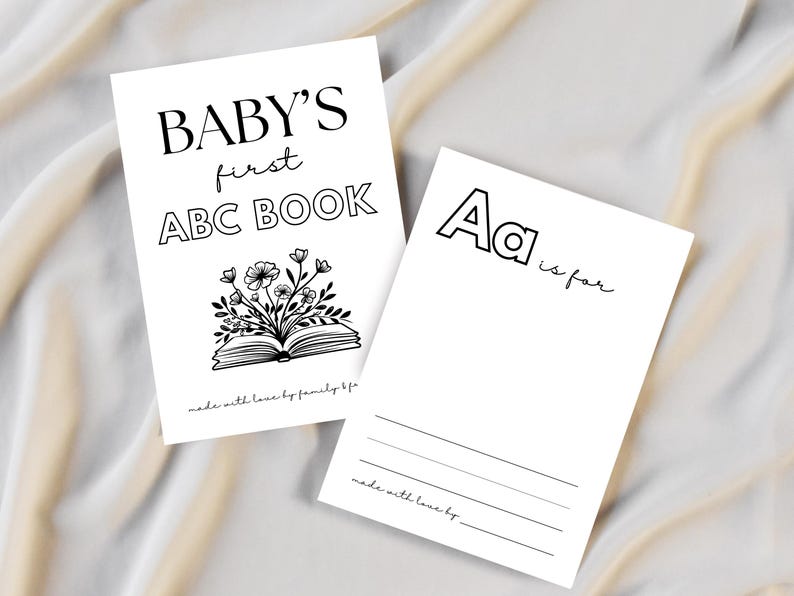Puede incluir: Dos tarjetas blancas con texto negro. Una dice "BABY'S first ABC BOOK" con una ilustraci&oacute;n floral. La otra tarjeta dice "Aa is for" con l&iacute;neas debajo. Ambas tarjetas tienen el texto "made with love by family bfa".