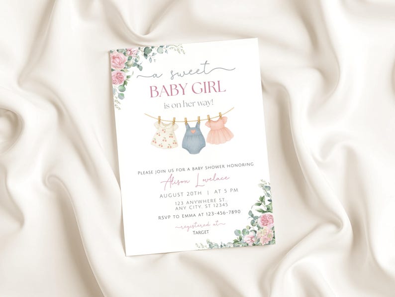 May include: A baby shower invitation with the text "a sweet BABY GIRL is on her way!" features watercolor illustrations of baby clothes hanging on a clothesline. Floral accents and event details are included.