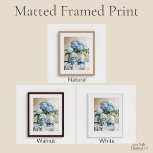 May include: Matted framed prints featuring a watercolor still life of blue hydrangeas in white and blue vases. The prints are available in natural, walnut, and white frames. The text "Sea Salt Homestyle Decor & Gifts" is in the bottom right corner.