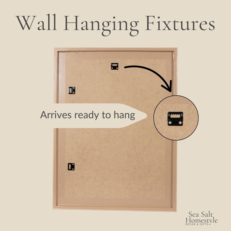 May include: A rectangular wall hanging fixture with a light brown frame and backing. The text "Wall Hanging Fixtures" is at the top. The text "Arrives ready to hang" is on the left. A close-up of the hanging hardware is on the right.