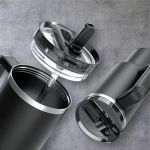 May include: Black insulated travel mug with a handle and a clear lid. The lid has a black flip-top closure and a silver rim. The mug is shown disassembled, with the lid separate from the body. The mug is designed to keep drinks hot or cold.