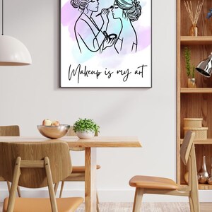 May include: A black and white line drawing of two women applying makeup. The background is a watercolor wash of pink and blue. The text "Makeup is my art" is below the drawing.