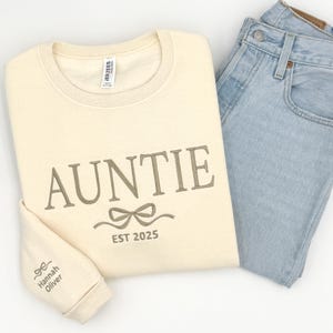 a pair of blue jeans and a white shirt