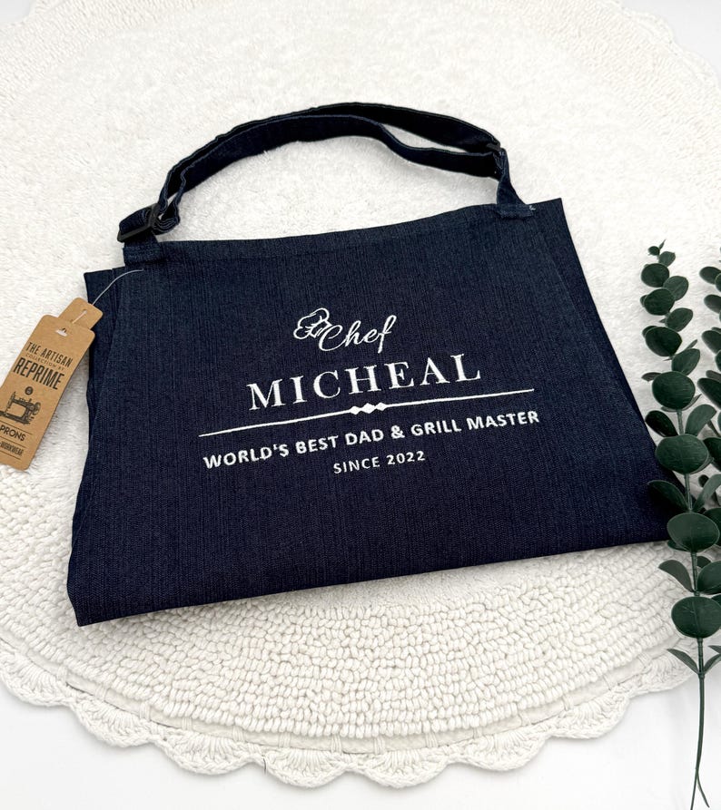 a black bag sitting on top of a white doily