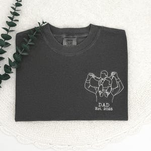 a t - shirt with a picture of a man on it