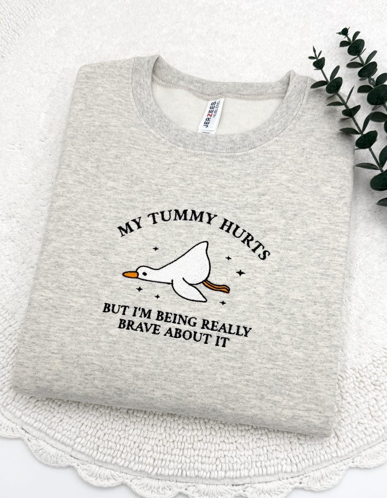 a t - shirt that says, my tummy hurts but i'm being
