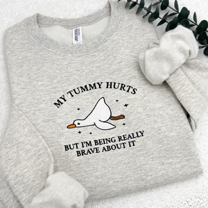a sweater with a picture of a bird on it