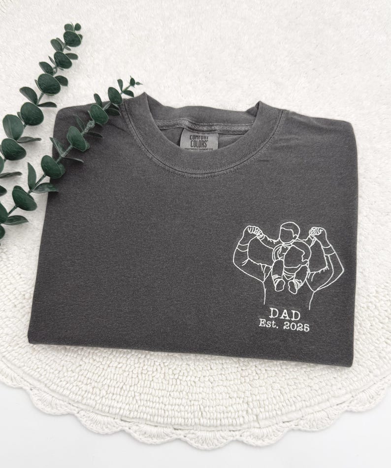 a t - shirt with a picture of a man and a woman on it