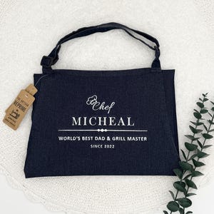 a black bag sitting on top of a white doily