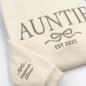 a white shirt with a bow on it