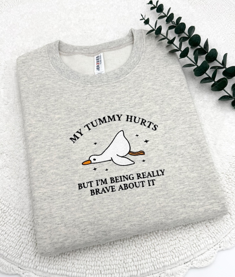 a t - shirt that says, my tummy hurts but i'm being