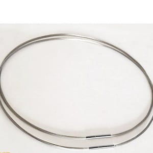 May include: A silver-toned, double-strand, cable chain necklace with a clasp closure.
