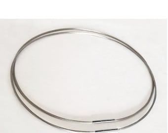 May include: A silver-toned, double-strand, cable chain necklace with a clasp closure.