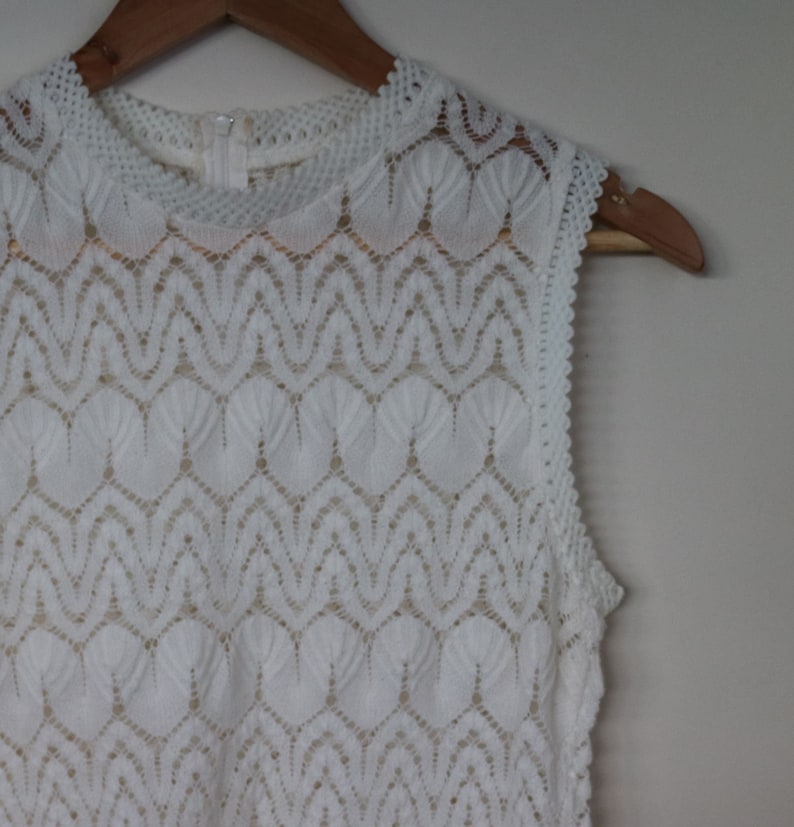 lacy white...ladies 1960s vintage knitted sleeveless blouse in white