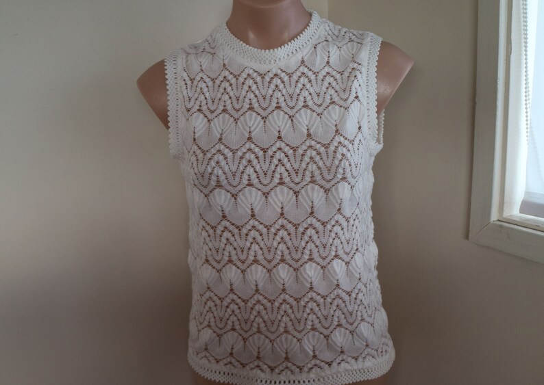 lacy white...ladies 1960s vintage knitted sleeveless blouse in white