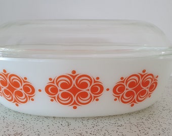 orange scrolls...vintage Pyrex  casserole dish with lid