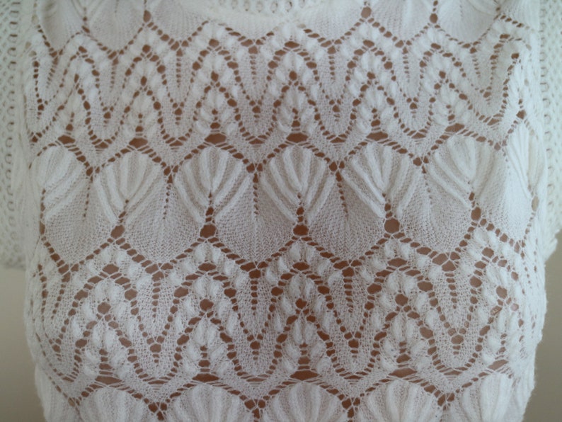 lacy white...ladies 1960s vintage knitted sleeveless blouse in white