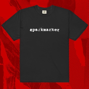 May include: Black t-shirt with the word "sparkmarker" printed in white on the front.