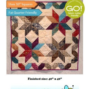 May include: A quilt pattern called "Night and Day" uses 10-inch squares and is fat quarter friendly. The quilt is made with a variety of fabrics in shades of red, blue, brown, and white. The quilt is finished at 40 inches by 40 inches. The pattern includes GO! instructions and is fabric cutter friendly.