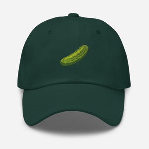 May include: A dark green baseball cap with an embroidered green pickle on the front.