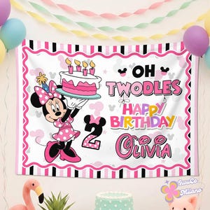 May include: A rectangular birthday banner featuring a cartoon mouse in a pink polka dot dress holding a cake with four candles. The text reads OH TWODLES HAPPY BIRTHDAY OLIVIA with a large number 2. The border is pink, white, and black stripes.