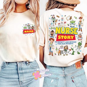 May include: Cream-colored t-shirt featuring a colorful graphic of cartoon characters and the text "NAME" on the front. The back of the shirt displays the words "NURSE STORY" with additional cartoon characters and the phrase "TO INFINITY AND BEYOND FOR OUR PATIENTS."