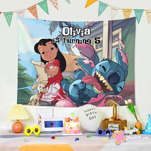 May include: A colorful tapestry featuring the characters Lilo and Stitch, with the text "Olivia is turning 5". The artwork depicts Lilo holding a scroll and Stitch with his tongue out. The background shows a tropical scene.