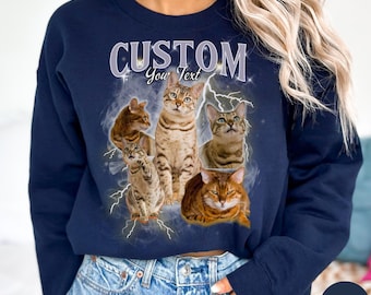 May include: Navy blue sweatshirt featuring a graphic of five cats with lightning bolt accents. The word "CUSTOM" is printed above the cats, with "Your Text" below. The sweatshirt is a solid navy color.