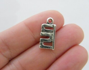 BULK 20 Running girl charms antique silver tone SP195