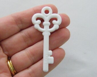 8 White acrylic plastic key pendants