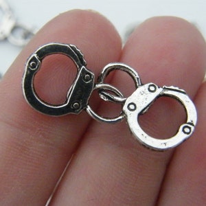 6 Pair of handcuff charms antique silver tone G24