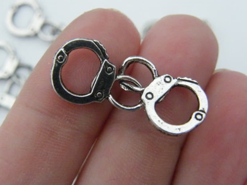 BULK 30 Pair of handcuff charms antique silver tone G24 image 1