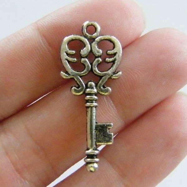 BULK 20 Key pendants (  double sided ) 33 x 13.5mm antique silver tone K38