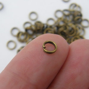 200 Split rings 5mm antique bronze tone