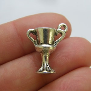 4 Trophy  charms antique silver tone P287