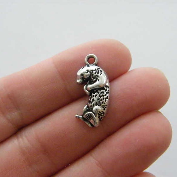 4 Otter charms antique silver tone A106